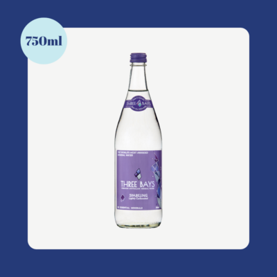 Three Bays Sparkling Natural Mineral Water 750ml glass bottle with purple label displayed on a clean blue background.